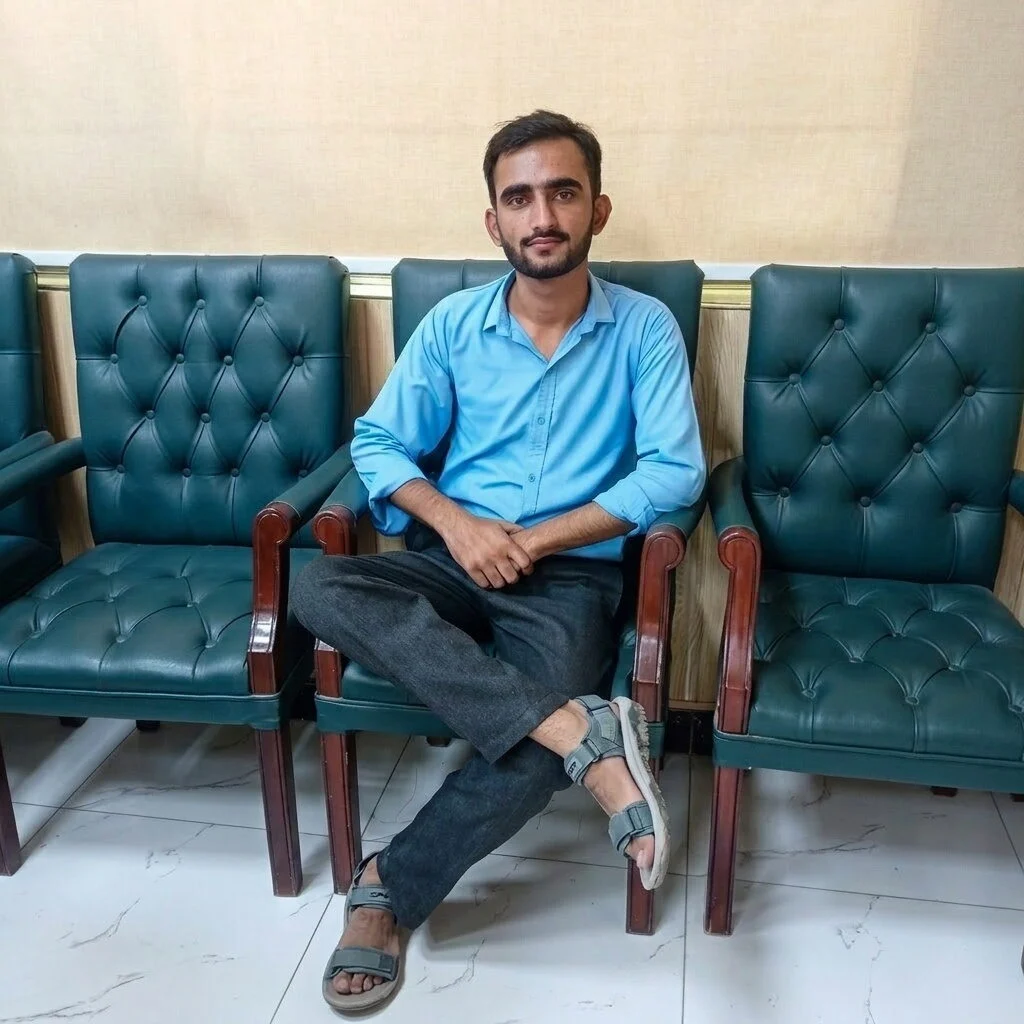 man sitting in blue teal chair portrait photo