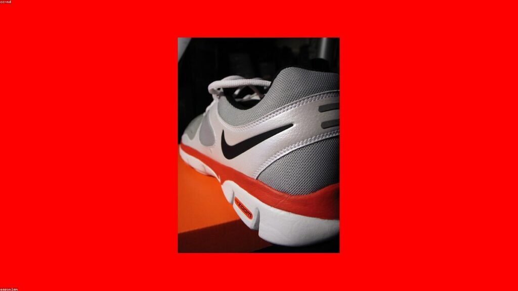 Nike running shoe closeup on red background for Nike affiliate program review